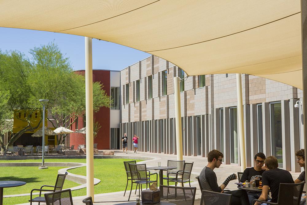 students eating outside of barrett dining hall in the great court