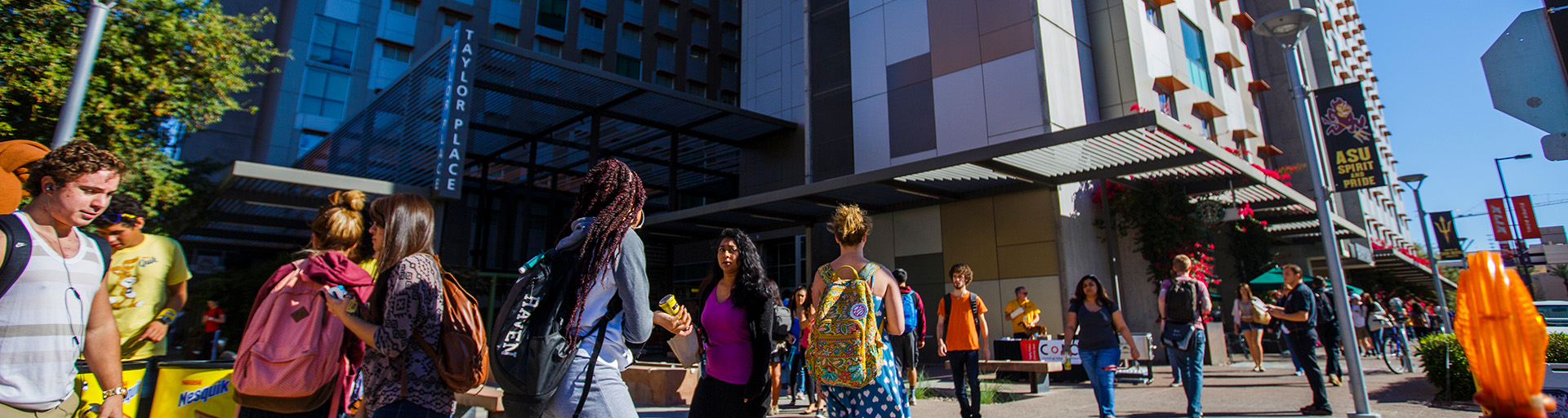 Students walking around Taylor Place at the ASU Downtown campus