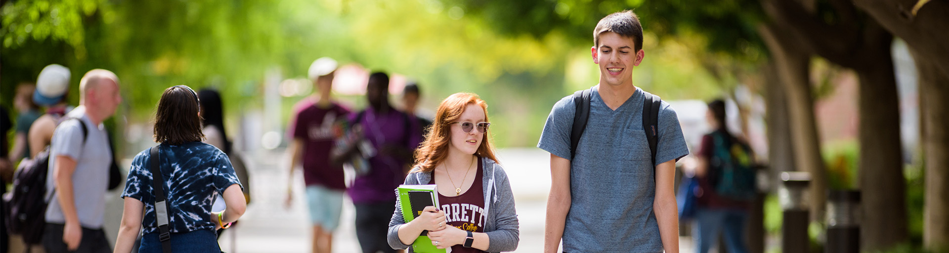 Students walking around the ASU West campus