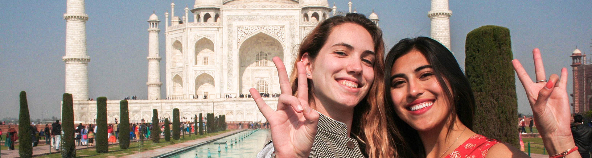 Two students in front of the Taj Mahal, India